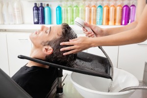 cosmetology professional washing hair