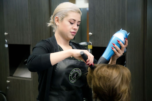 Student working on a client's hair