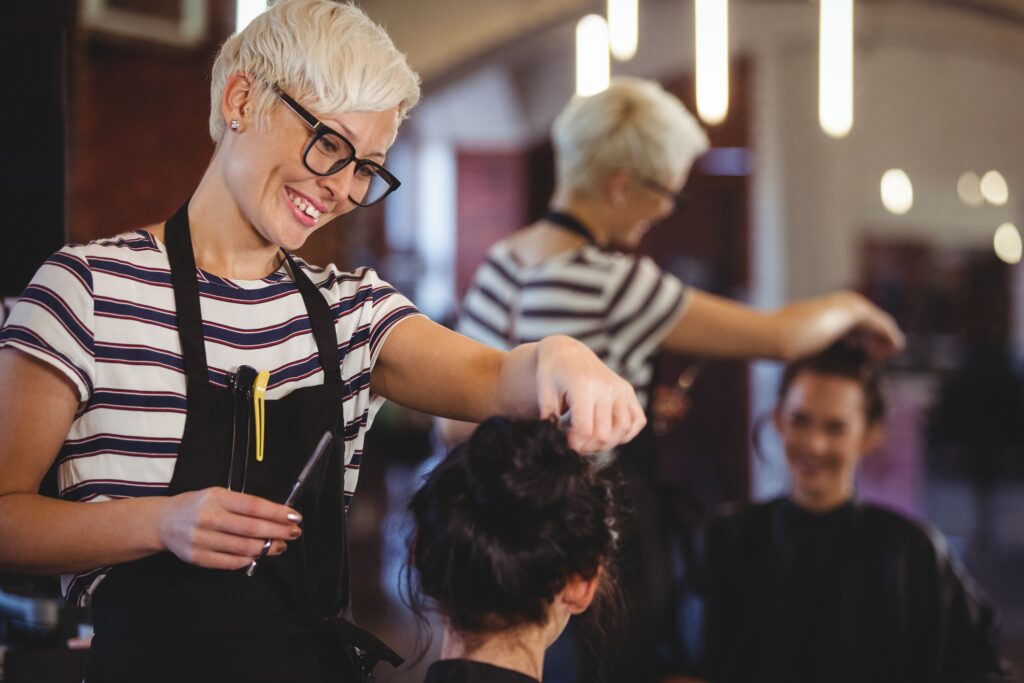 a cosmetologist at work in a salon