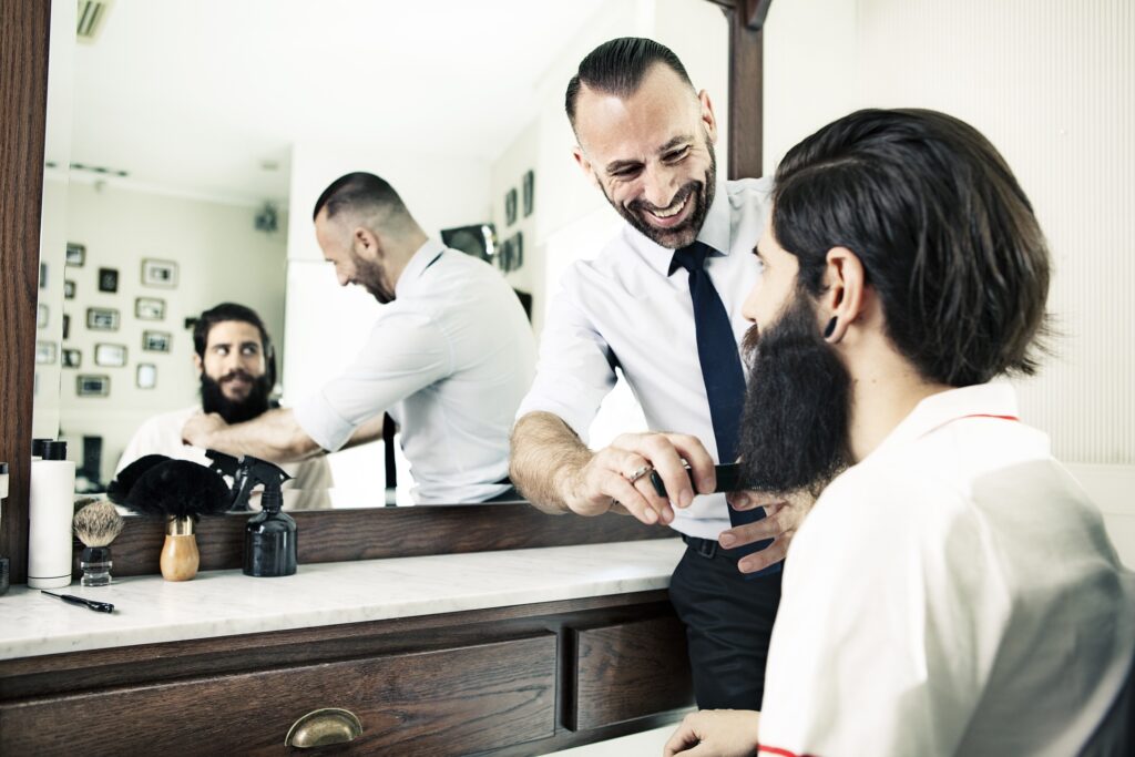 Barber with client in barbershop