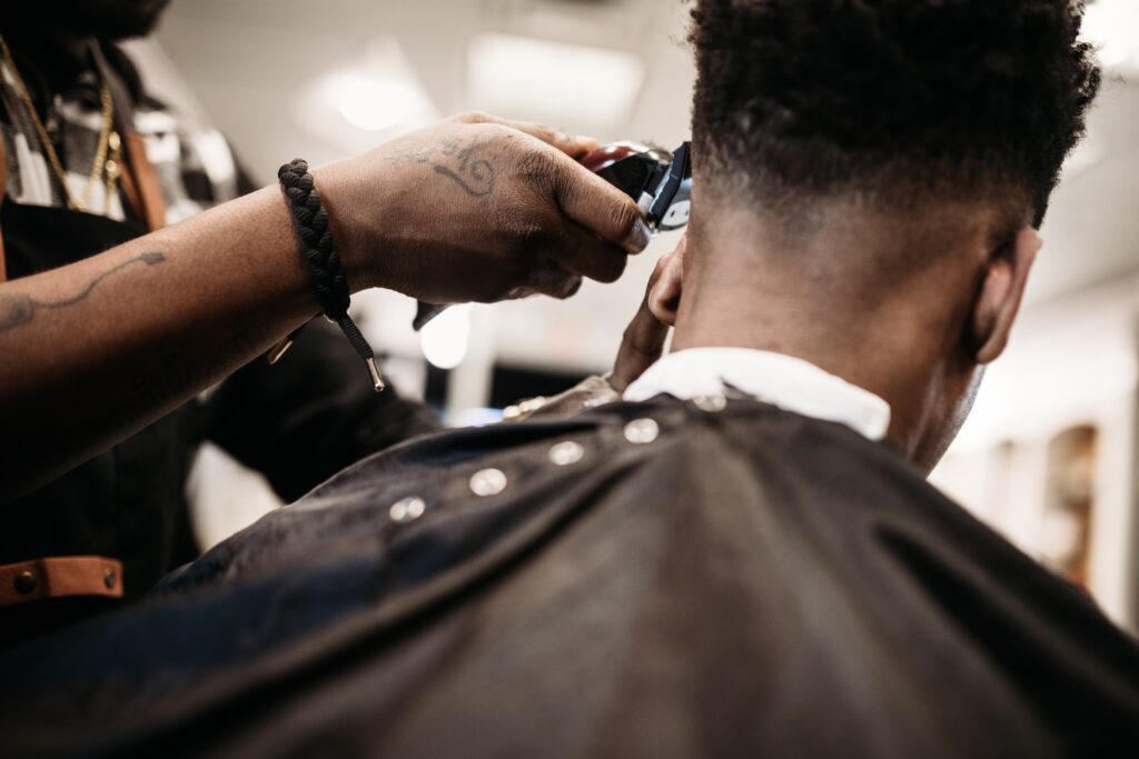 Barber giving Men's haircut