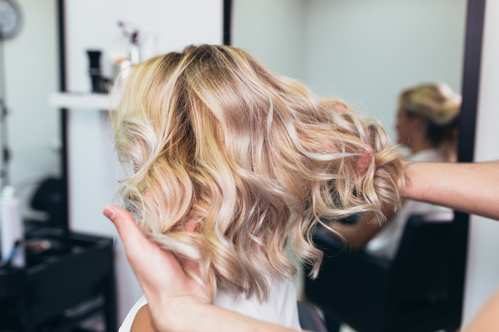 stylist working with client's hair