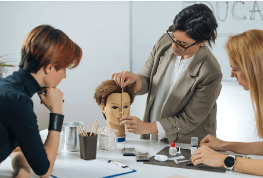 woman parting hair on a hair mannequin