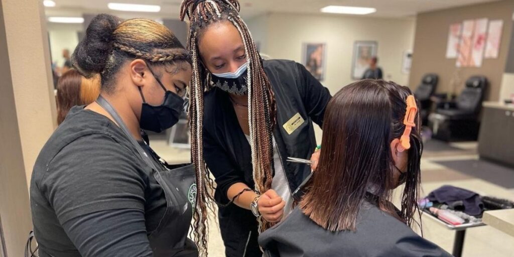 SSA students learning how to cut hair